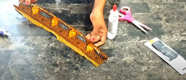 how to make an african fabric rope necklace quick simple tutorial, Applying glue to the fabric necklace cord
