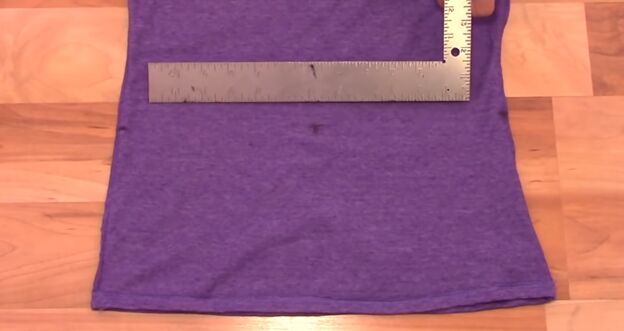 3 no sew diy t shirt cutting ideas that will give your tees new life, Measuring the new bottom of the crop top