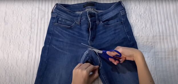 how to make low waisted jeans high waisted in 3 easy steps, Cutting out the crotch of the jeans