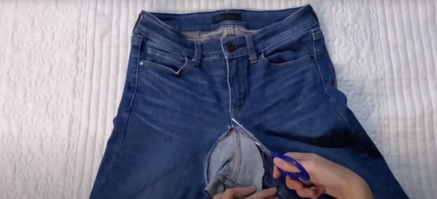 how to make low waisted jeans high waisted in 3 easy steps, Cutting open the back crotch of the jeans