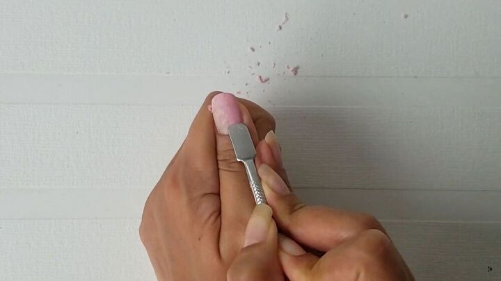 the best way to remove gel nail polish without damaging nails, Scrape the gel off with a cuticle pusher