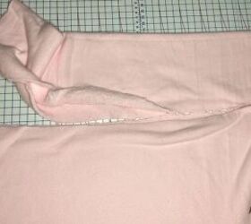 this cute diy skims cozy dupe looks just like the original, Cutting the pink Sherpa fabric