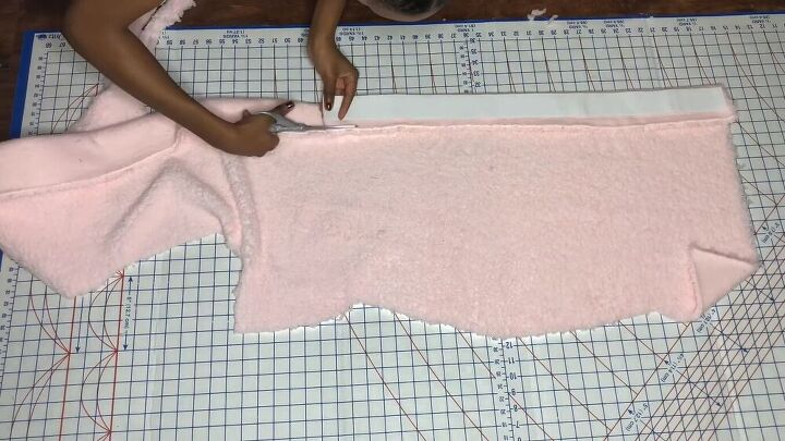 this cute diy skims cozy dupe looks just like the original, Cutting a waistband out of pink Sherpa fabric