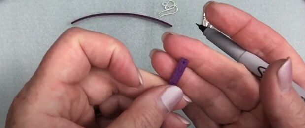 how to make leather feather earrings cute diy tutorial, Marking holes in the leather