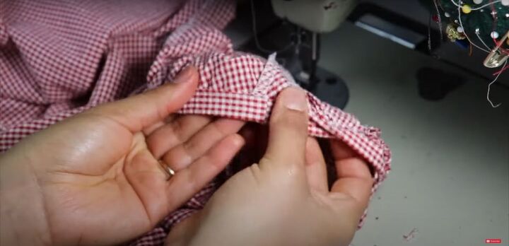 how to make a pretty strawberry blouse diy bow back top tutorial, Folding back the binding on the sleeve hems