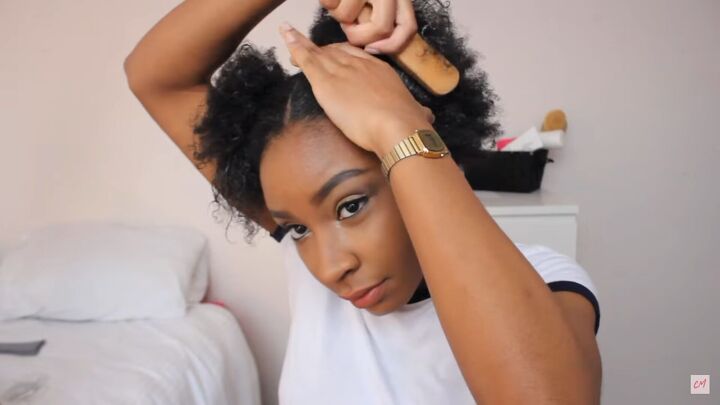 3 cute protective hairstyles for curly hair that are super easy to do, Using a hard bristle brush to smooth hair