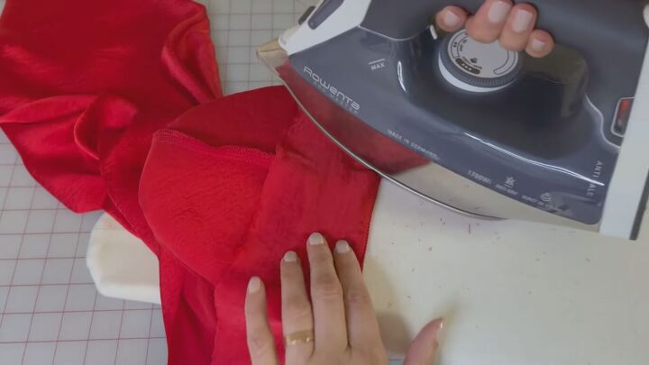 how to make a sexy slip dress step by step sew along tutorial, Pressing the DIY slip dress with a clapper