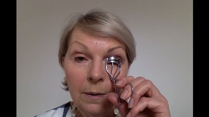 how to easily perfectly apply eye makeup for mature women, Using an eyelash curler on older eyes