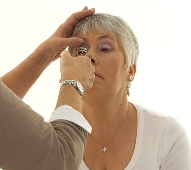 how to perfectly apply eye makeup for older women with glasses, Using an eyelash curler before mascara
