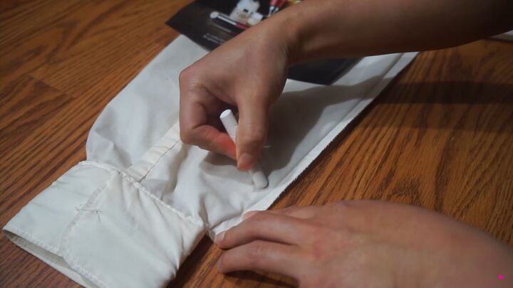 how to make a trendy diy mandarin collar top from a plain shirt, Marking the cuffs of the DIY blouse