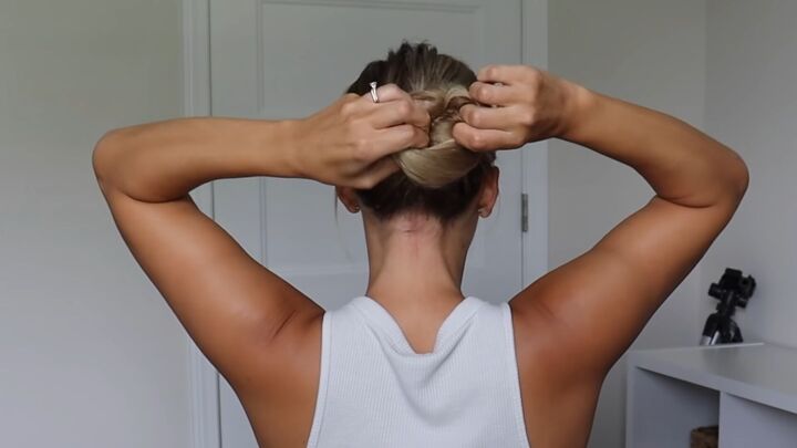 how to tie your hair without a hair tie 4 different cute ways, Pull the hair up through the bun