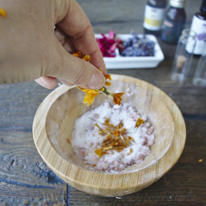 diy bath salt homemade gift for busy moms, adding calendula petals into bath salts