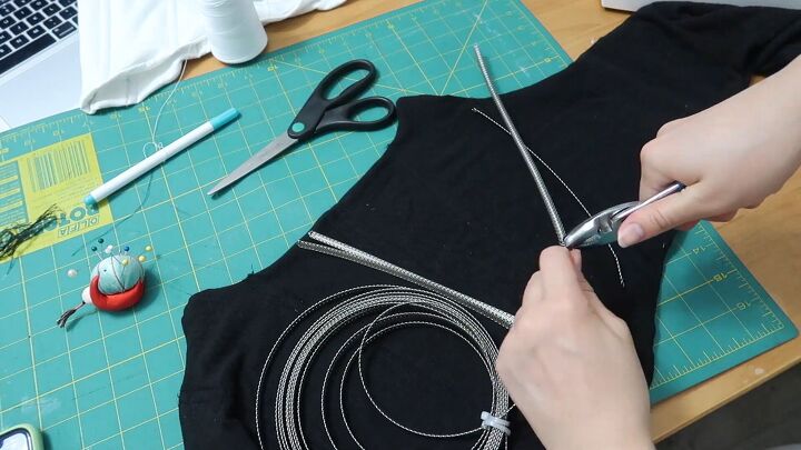 how to make a cute corset out of an old hoodie diy tutorial, Inserting the boning into the DIY corset top