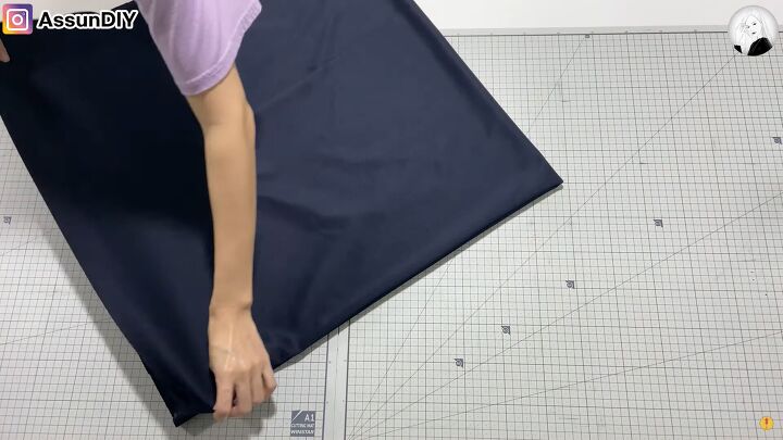 how to make an elegant circle vest you can wear 3 different ways, Folding the fabric ready to cut