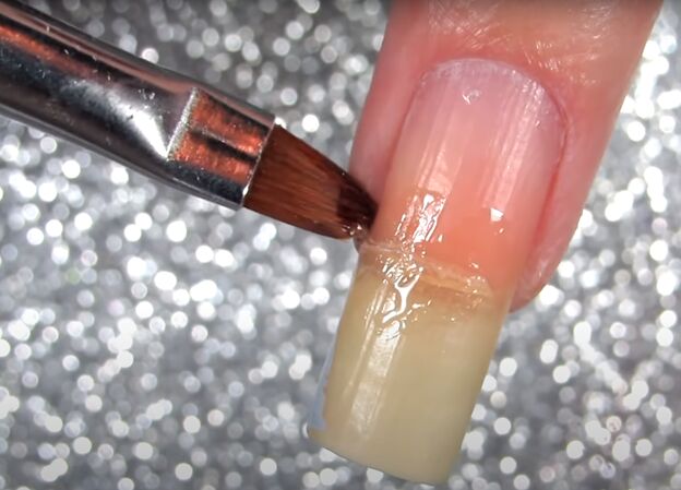 how to easily fix a badly broken nail with a teabag some superglue, Applying super glue to the broken nail