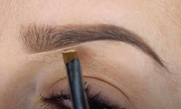 how to fill in eyebrows like a pro 3 different ways, Using concealer underneath the eyebrow