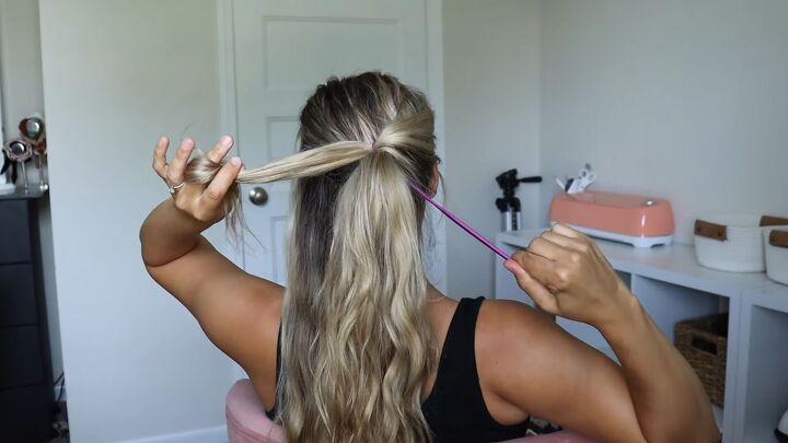 5 unique ponytails you can easily make with the topsy tail tool, Pulling hair through a ponytail with a tool