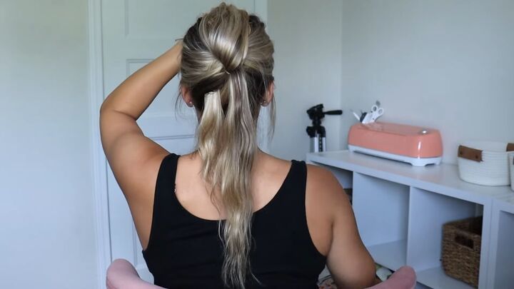 5 unique ponytails you can easily make with the topsy tail tool, Tying the ends with a clear elastic