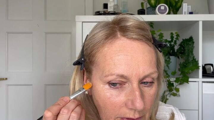 quick easy 5 minute makeup routine for women over 50, Applying concealer to age spots and sun spots