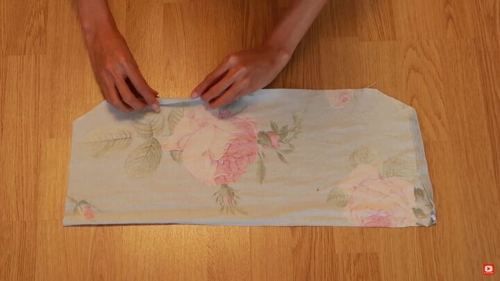 how to make a gorgeous floral diy dress out of an old blanket, Hemming the edges of the bodice fabric