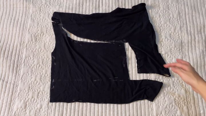 how to easily upcycle tank tops t shirts to make cute diy crop tops, Cutting the t shirt to make a DIY crop top