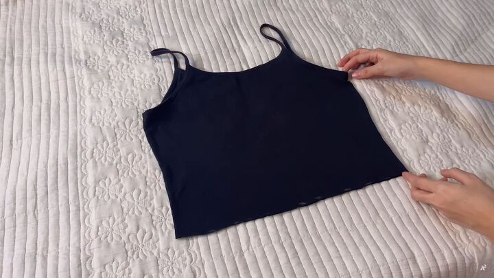 how to easily upcycle tank tops t shirts to make cute diy crop tops, Cutting the bottom off the tank top