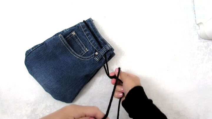 how to make a cute drawstring bag from old jeans step by step, Inserting the drawstring into the bag