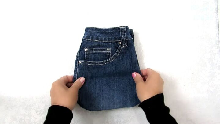 how to make a cute drawstring bag from old jeans step by step, Making a DIY denim bag
