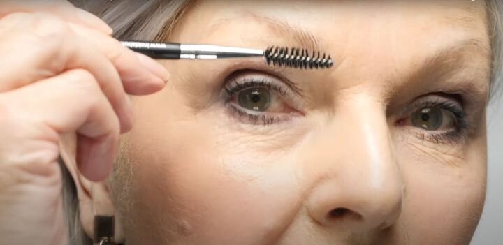 how to properly define eyebrows over 50 makeup for mature faces, Grooming eyebrows with a spoolie brush