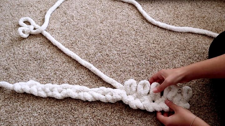 how to make a gigantic diy chunky knit cardigan by doing slip knots, Looping through the existing knots