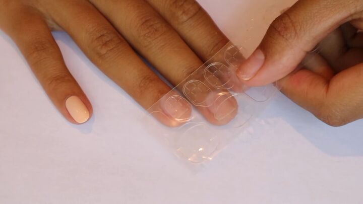 how to apply press on nails with adhesive tabs in 7 simple steps, Using press on nails with adhesive tabs