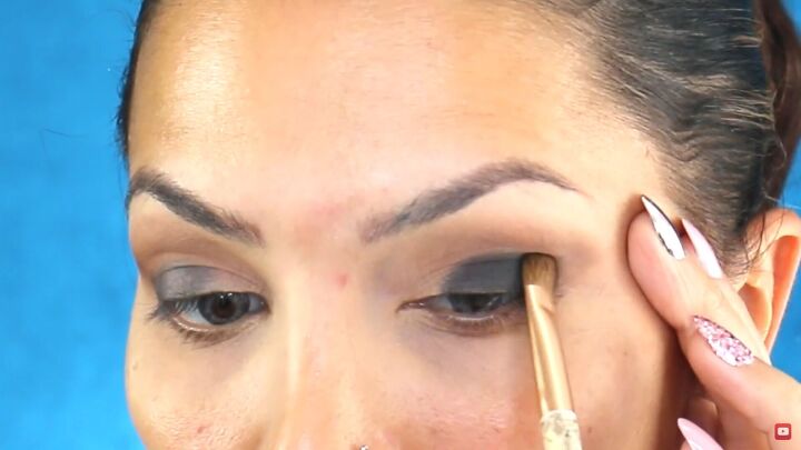 perfect the sultry eye look with this easy smokey eye palette tutorial, Dabbing the darkest color onto the base