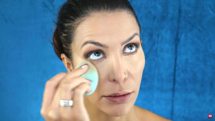 perfect the sultry eye look with this easy smokey eye palette tutorial, Blending concealer with a makeup sponge