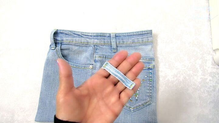 how to make a jean pocket purse in 6 simple steps, Sewing an extra belt loop onto the jean purse