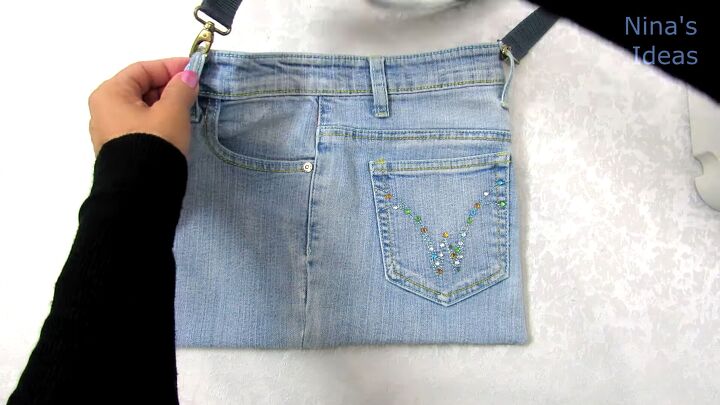 how to make a jean pocket purse in 6 simple steps, Attaching a strap to the DIY jean purse