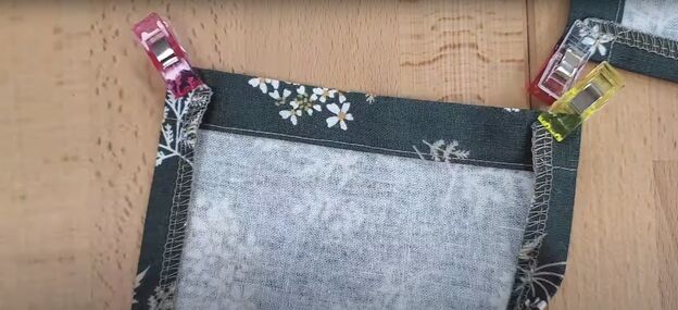 how to sew a half apron with pockets in 9 simple steps, Pinning the pockets ready to sew and serge