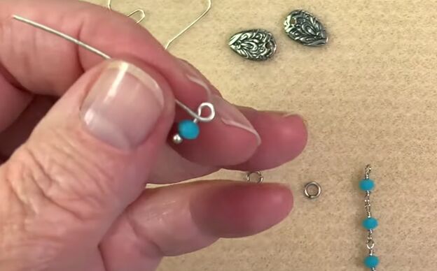 how to make quick easy chain earrings at home, Using pliers to bend the head pin