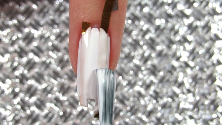10 easy peasy nail art designs for beginners step by step tutorial, Painting white nail polish over the nail tape