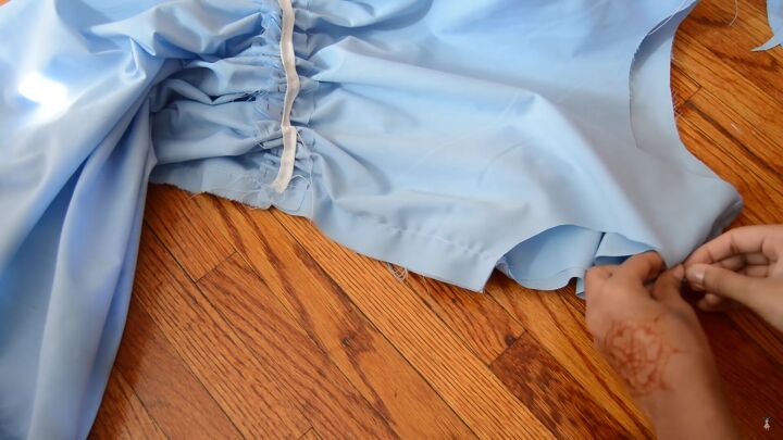how to sew an alice in wonderland blue dress for cosplay or halloween, Pinning the sleeves to the armholes