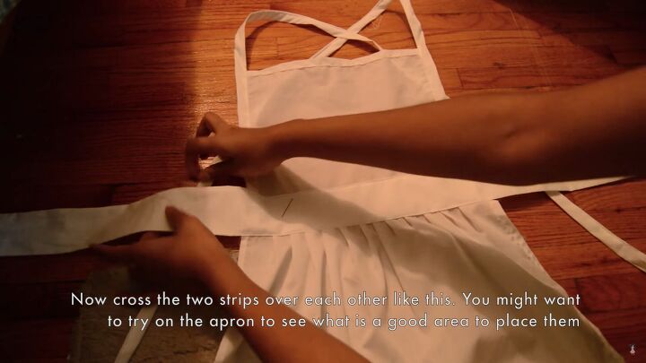 how to sew a charming alice in wonderland apron for an alice costume, Attaching the shoulder ties to the waist ties