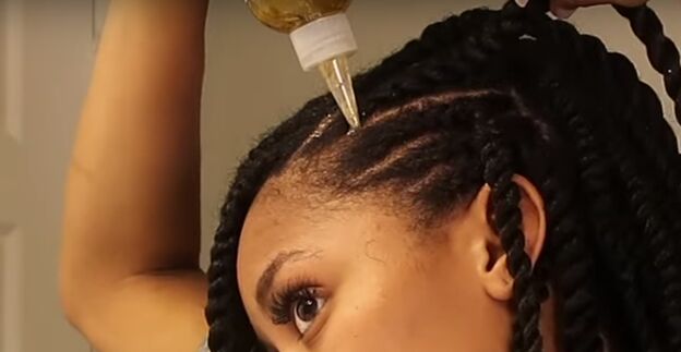 how to do perfect mini twists on natural hair in 6 simple steps, Applying hair growth oil to the scalp