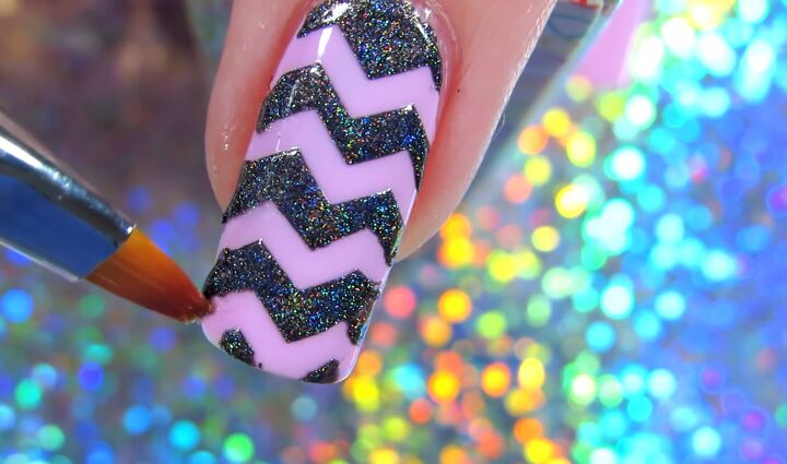 how to use nail vinyls to create colorful fun nail vinyl designs, Applying a top coat over the nail vinyl desig