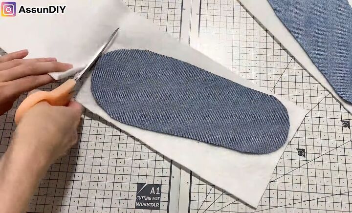 cute diy slippers tutorial how to make slippers from old jeans, Cutting the fusible fleece using the denim