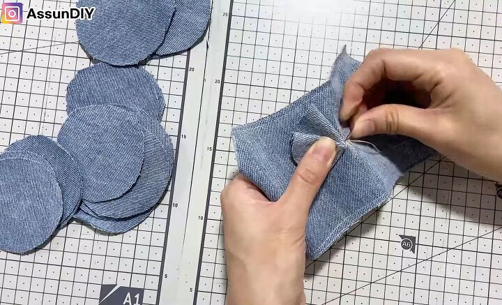 cute diy slippers tutorial how to make slippers from old jeans, Sewing the flower design onto the slippers
