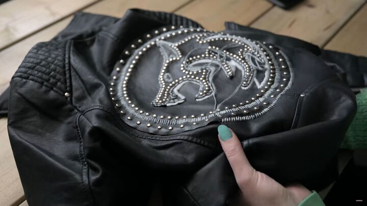 how to make a fierce diy witcher jacket worthy of geralt of rivia, Sewing the wolf motif onto the leather jacket