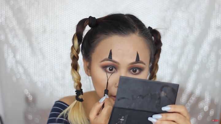5 last minute diy easy halloween costumes you can do with makeup, Drawing triangles above and below the eyes