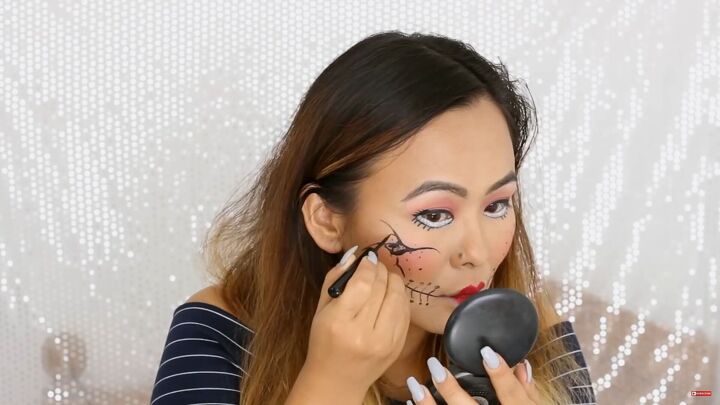 5 last minute diy easy halloween costumes you can do with makeup, Drawing crack designs with liquid eyeliner
