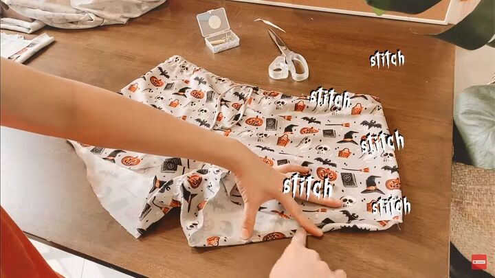 how to sew cute diy halloween pajamas perfect for scary movie nights, Hemming the pajama shorts