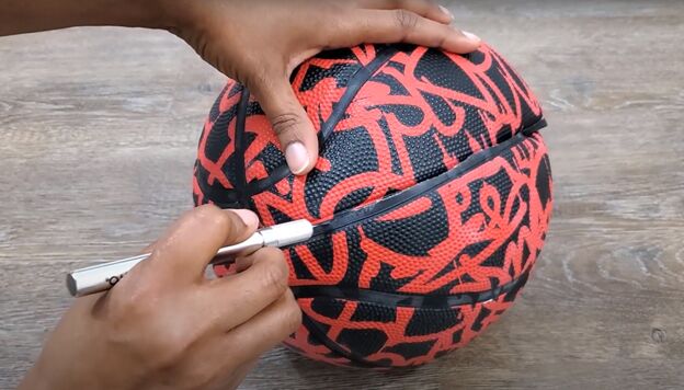 how to make a diy basketball purse unique fun tutorial, Cutting open the basketball to make a purse