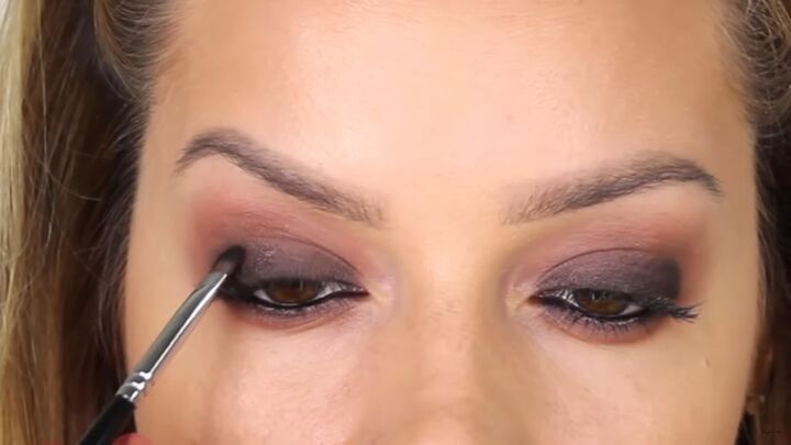how to do intricate masquerade mask makeup with liquid eyeliner, Blending black eyeshadow with the brown